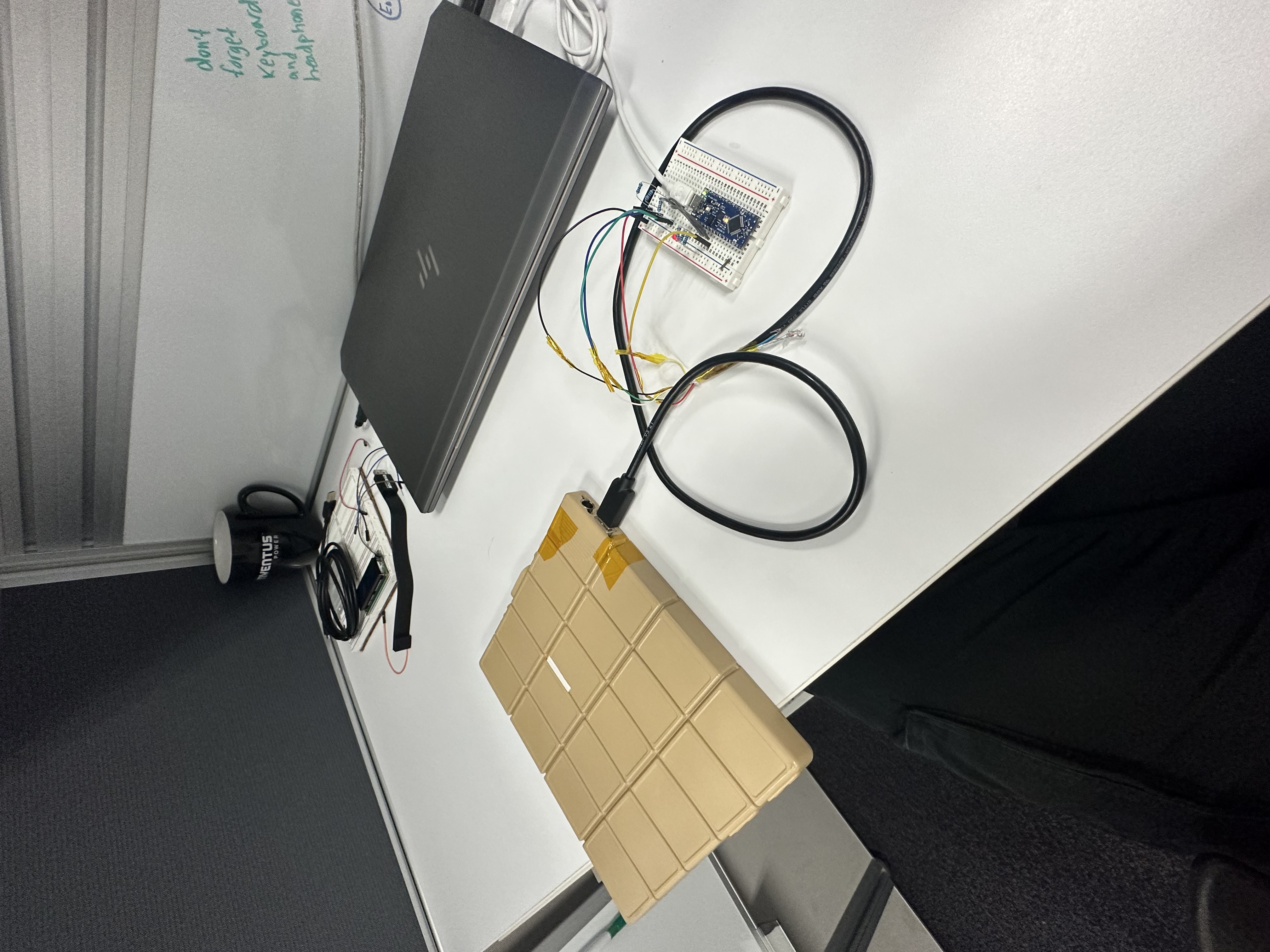 Battery pack connected to a laptop and breadboard test setup