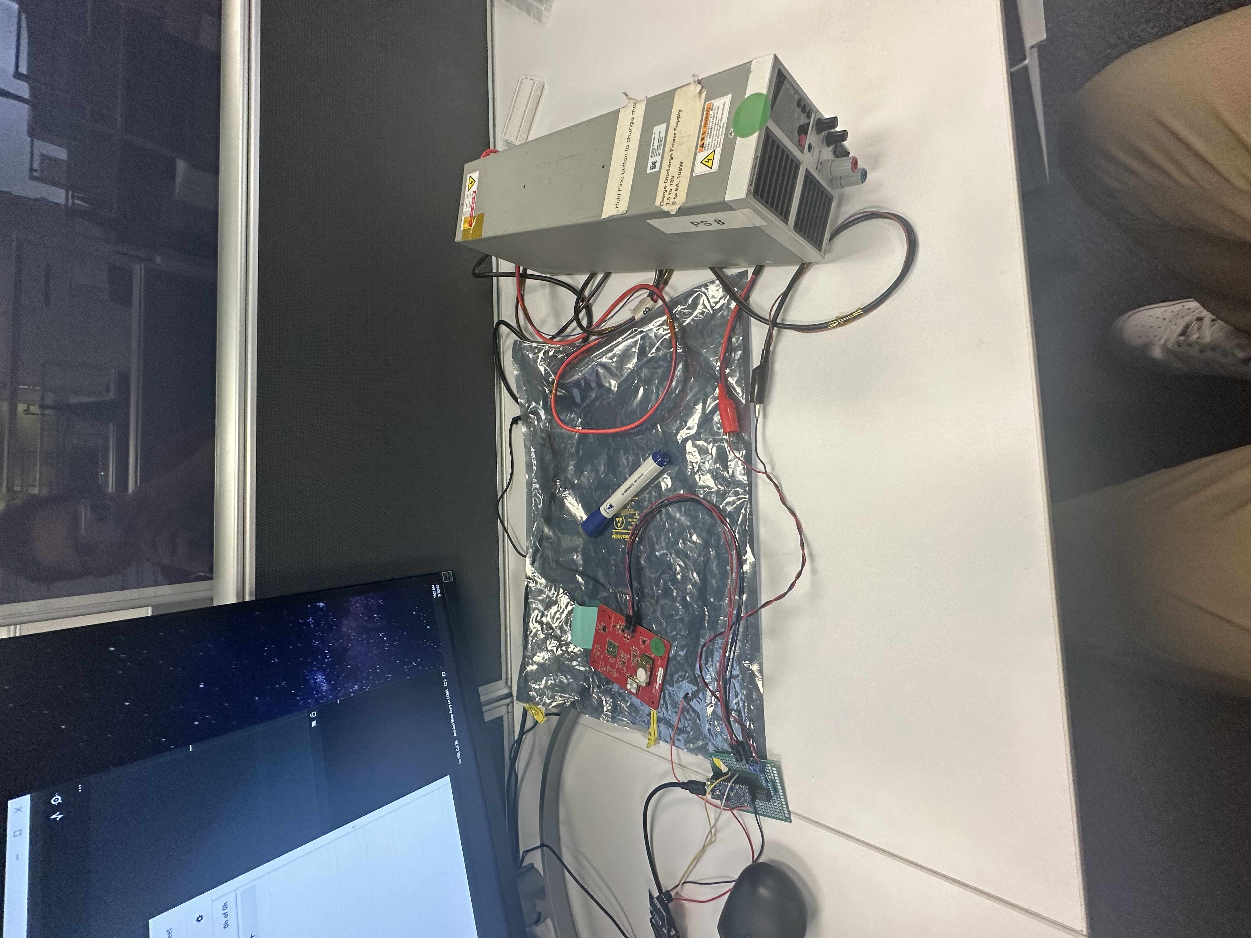 Bench setup with power supply and test hardware